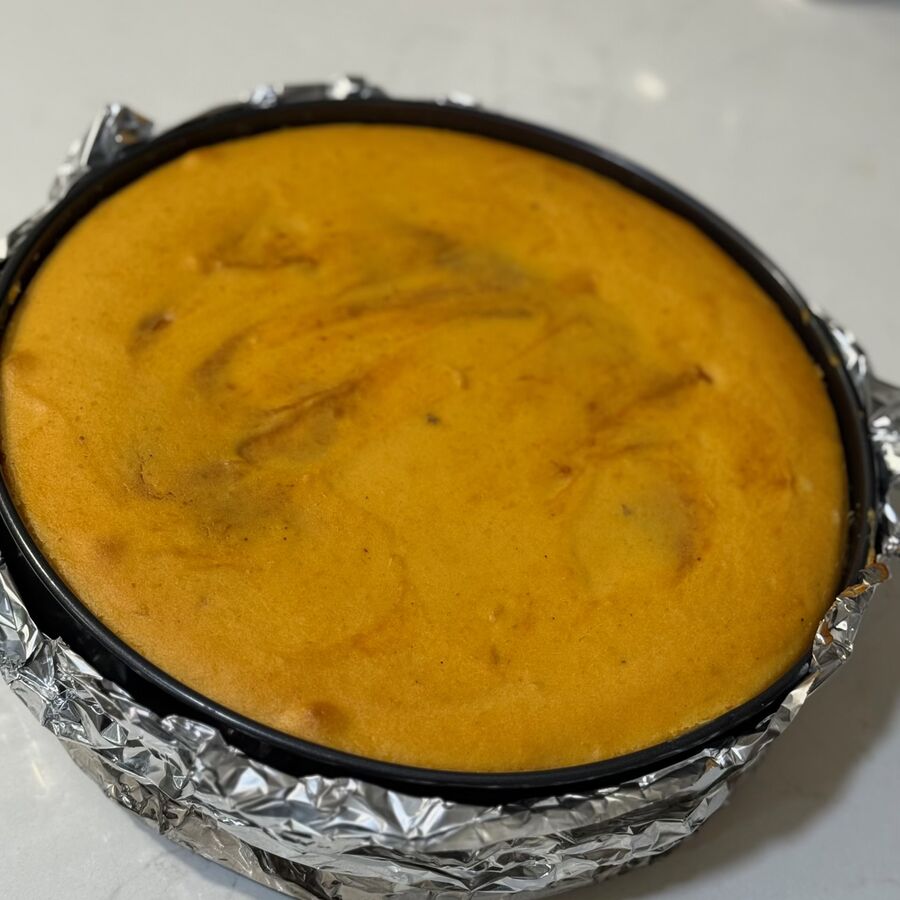 Baked sweet potato cheesecake before the streusel goes on